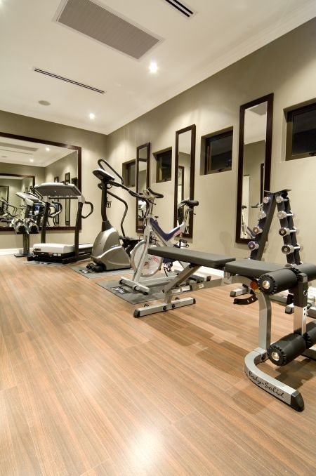 Premium wood-look flooring in a private gym at Monte Cristo Estate